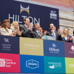 Hilton Worldwide President and Chief Executive Officer Christopher J. Nassetta, joined by hotel team members and executives from the company as well as majority shareholder Blackstone, rings the NYSE Opening Bell® to celebrate the company's reentry into the public market.