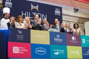Hilton Worldwide President and Chief Executive Officer Christopher J. Nassetta, joined by hotel team members and executives from the company as well as majority shareholder Blackstone, rings the NYSE Opening Bell® to celebrate the company's reentry into the public market.